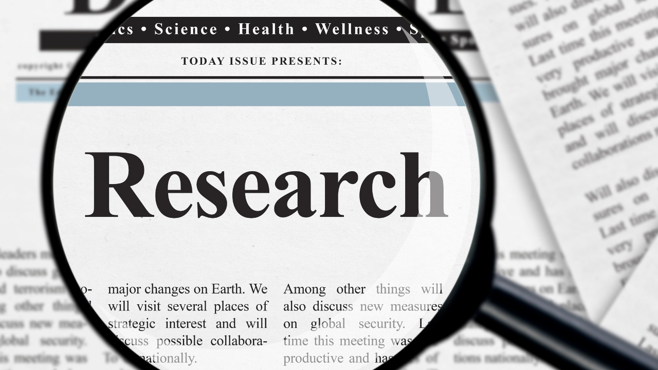 a magnifying class looking at research | Scott Legal, P.C. a magnifying class looking at research