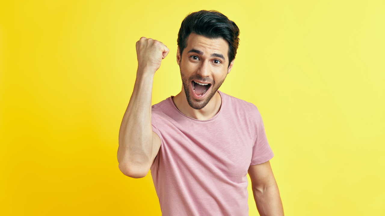 A happy man celebrating | Scott Legal, P.C. A happy man celebrating