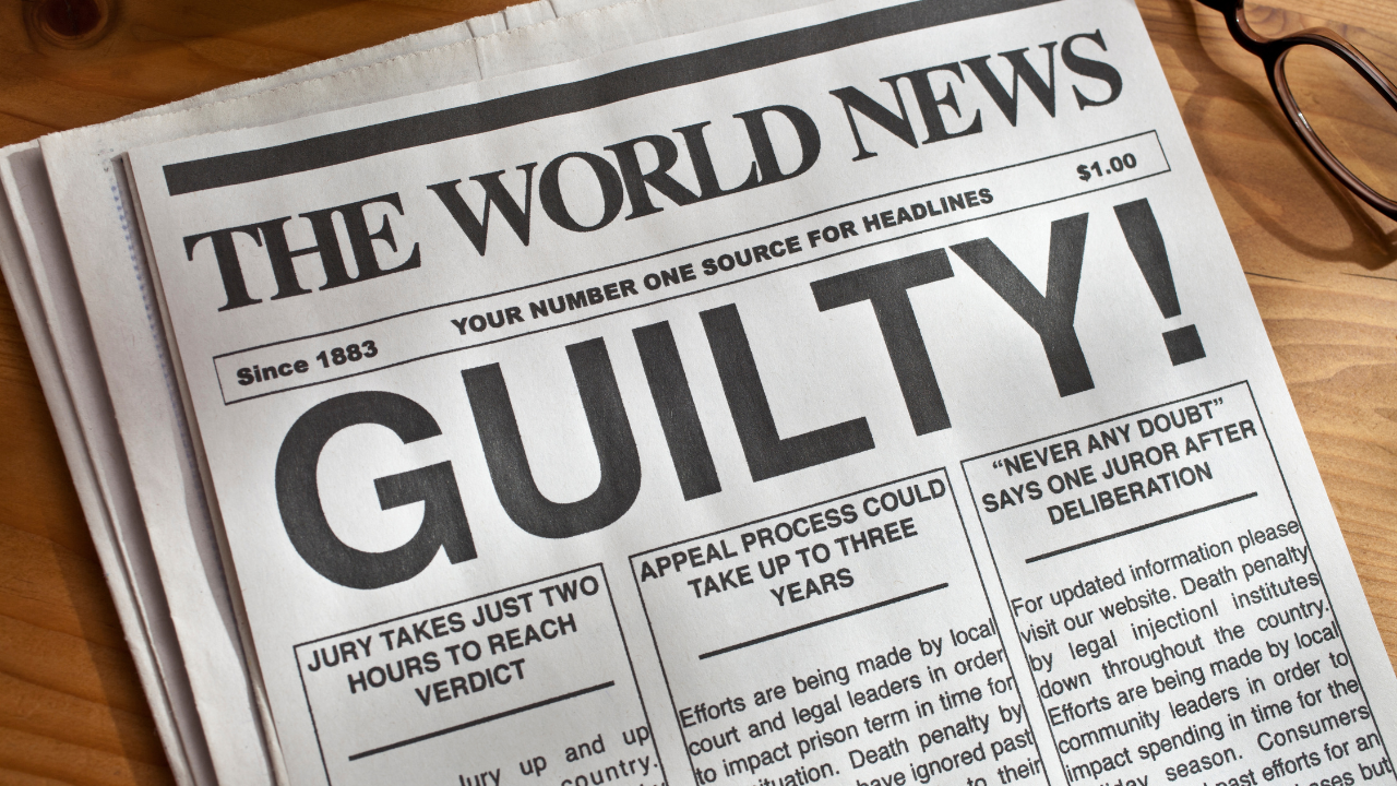 a newspaper with a "guilty" headline