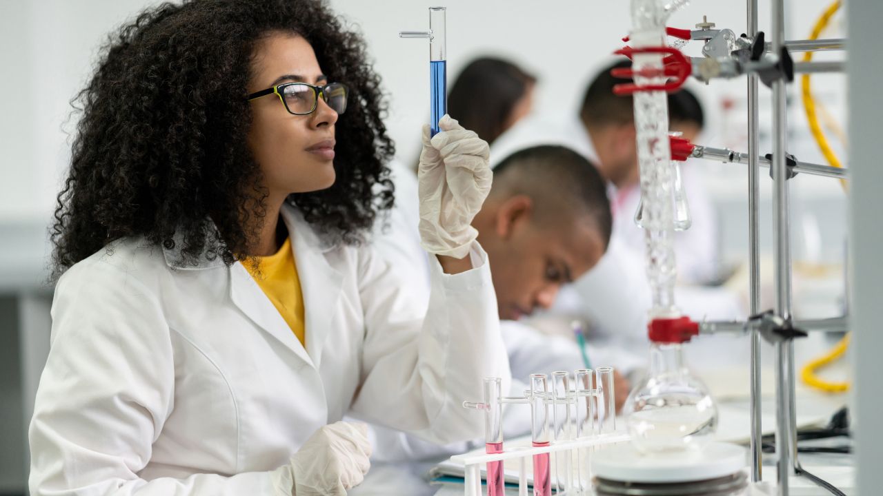 A woman working in a research lab | Scott Legal, P.C. A woman working in a research lab