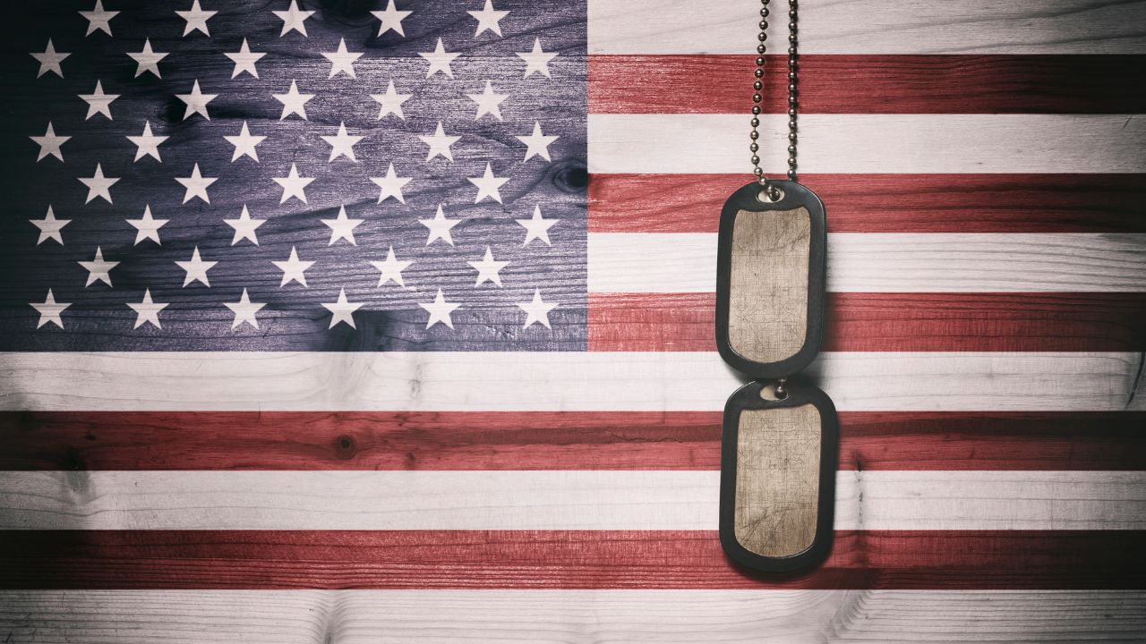 A US flag and military tags | Scott Legal, P.C. A US flag and military tags