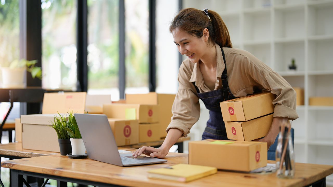 A seld-employed business owner packing boxes | Scott Legal, P.C. A seld-employed business owner packing boxes