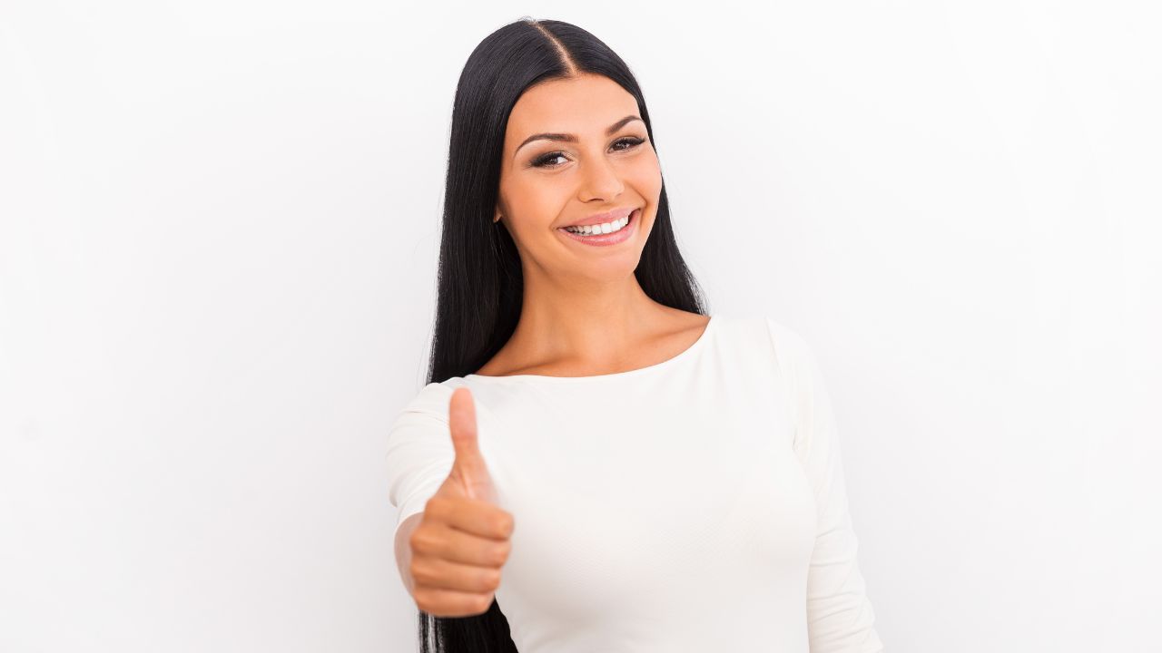 A woman doing thumbs up ) | Scott Legal, P.C. A woman doing thumbs up )