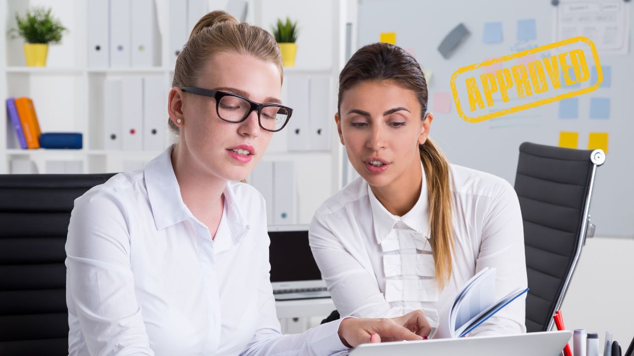 Two production company entrepreneurs working in office | Scott Legal, P.C. Two production company entrepreneurs working in office
