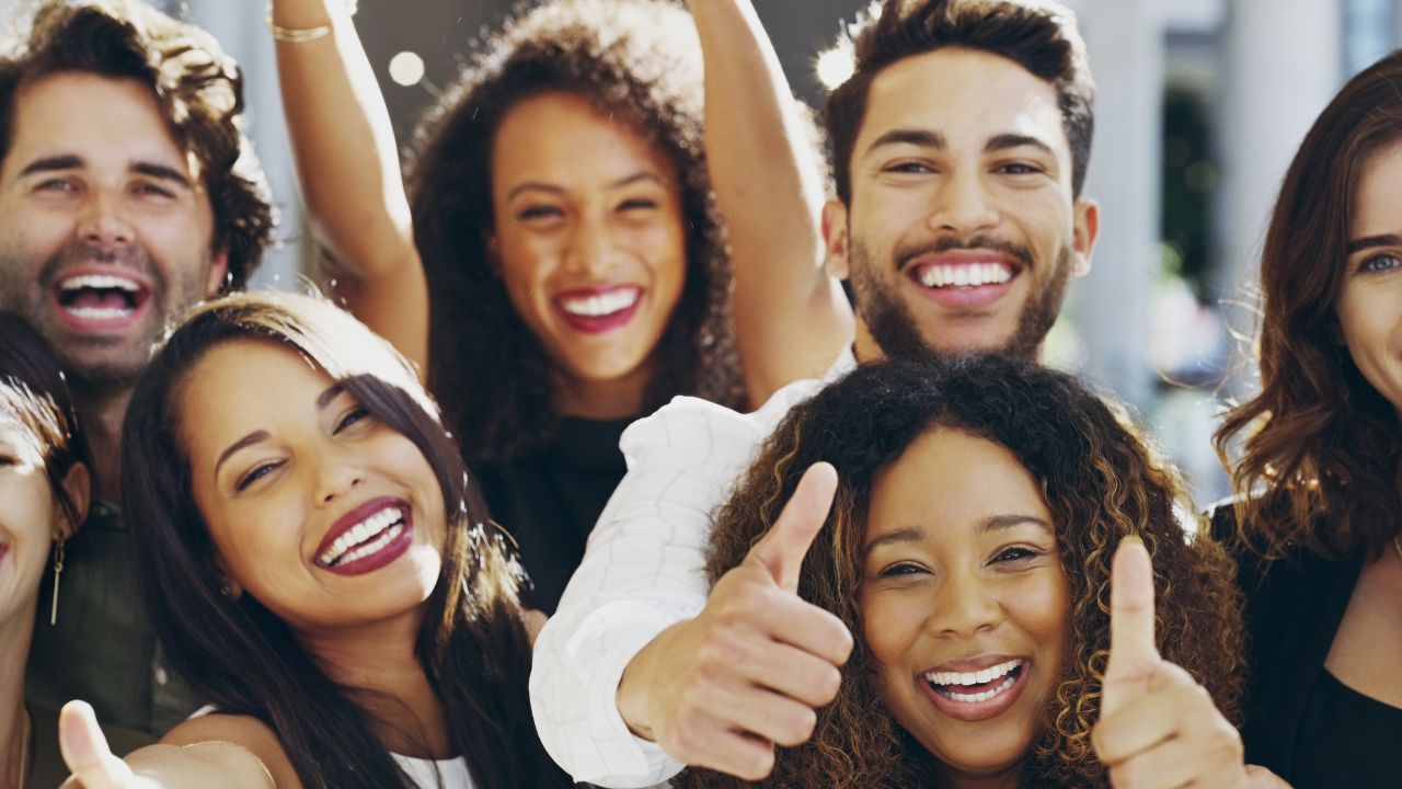 a group celebrating with a thumbs up | Scott Legal, P.C. a group celebrating with a thumbs up