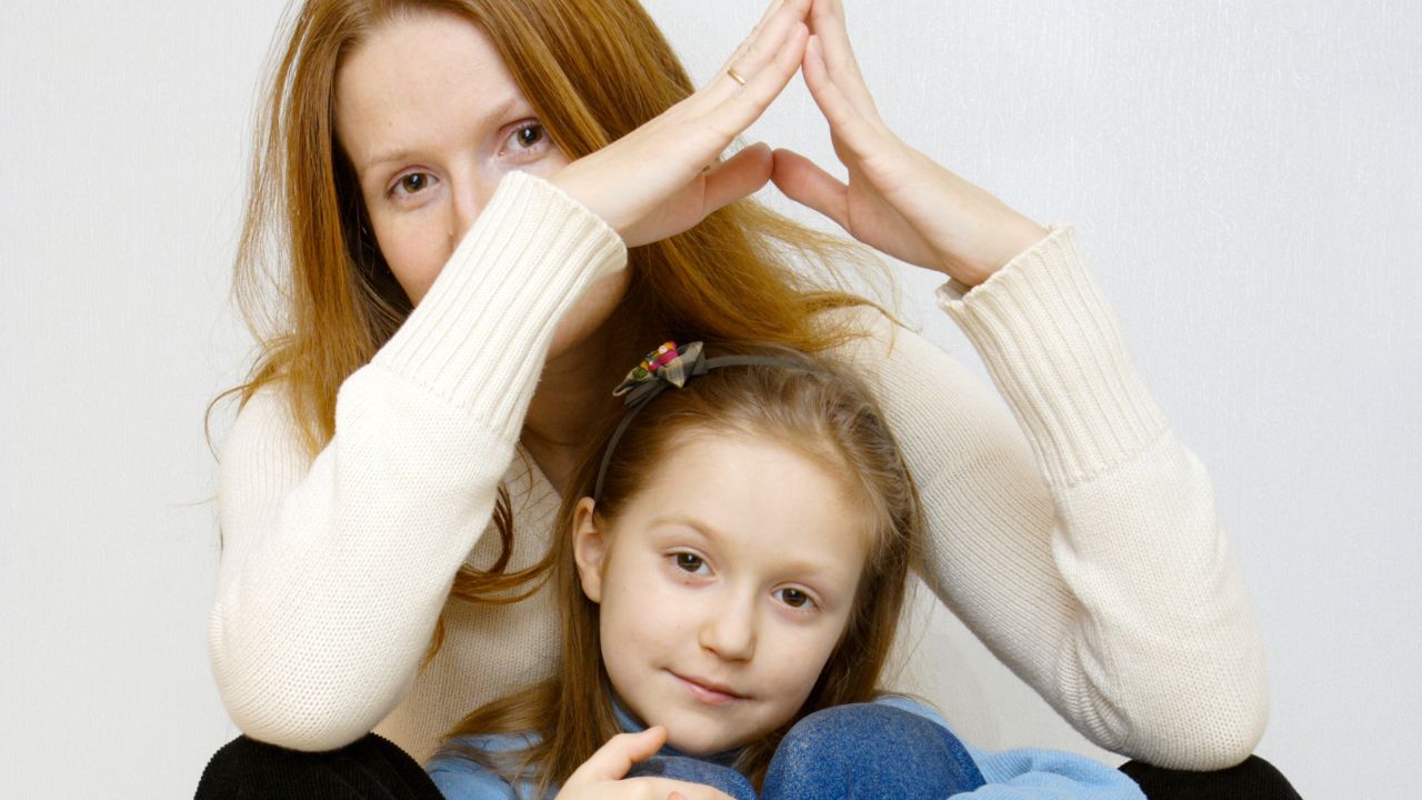 A woman and child sitting together | Scott Legal, P.C. A woman and child sitting together