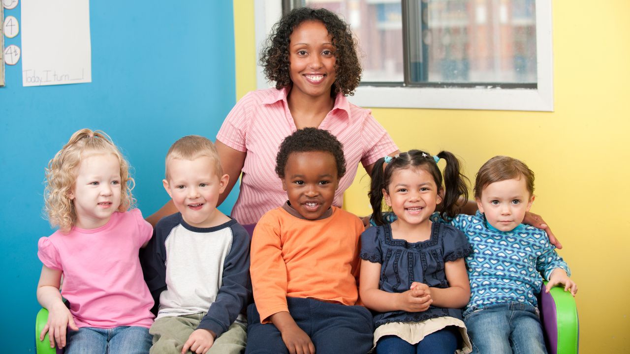 A group of children and a teacher | Scott Legal, P.C. A group of children and a teacher