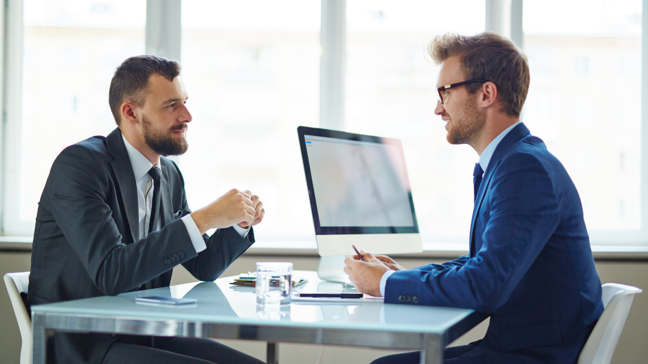 Two business men in a meeting | Scott Legal, P.C. Two business men in a meeting
