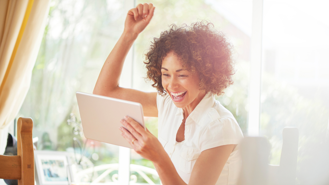A woman celebrating a win | Scott Legal, P.C. A woman celebrating a win