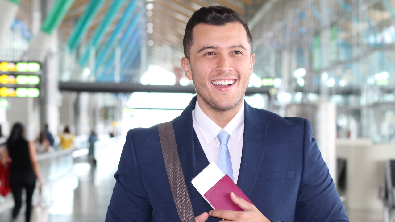 A happy business man arriving at the airport | Scott Legal, P.C. A happy business man arriving at the airport