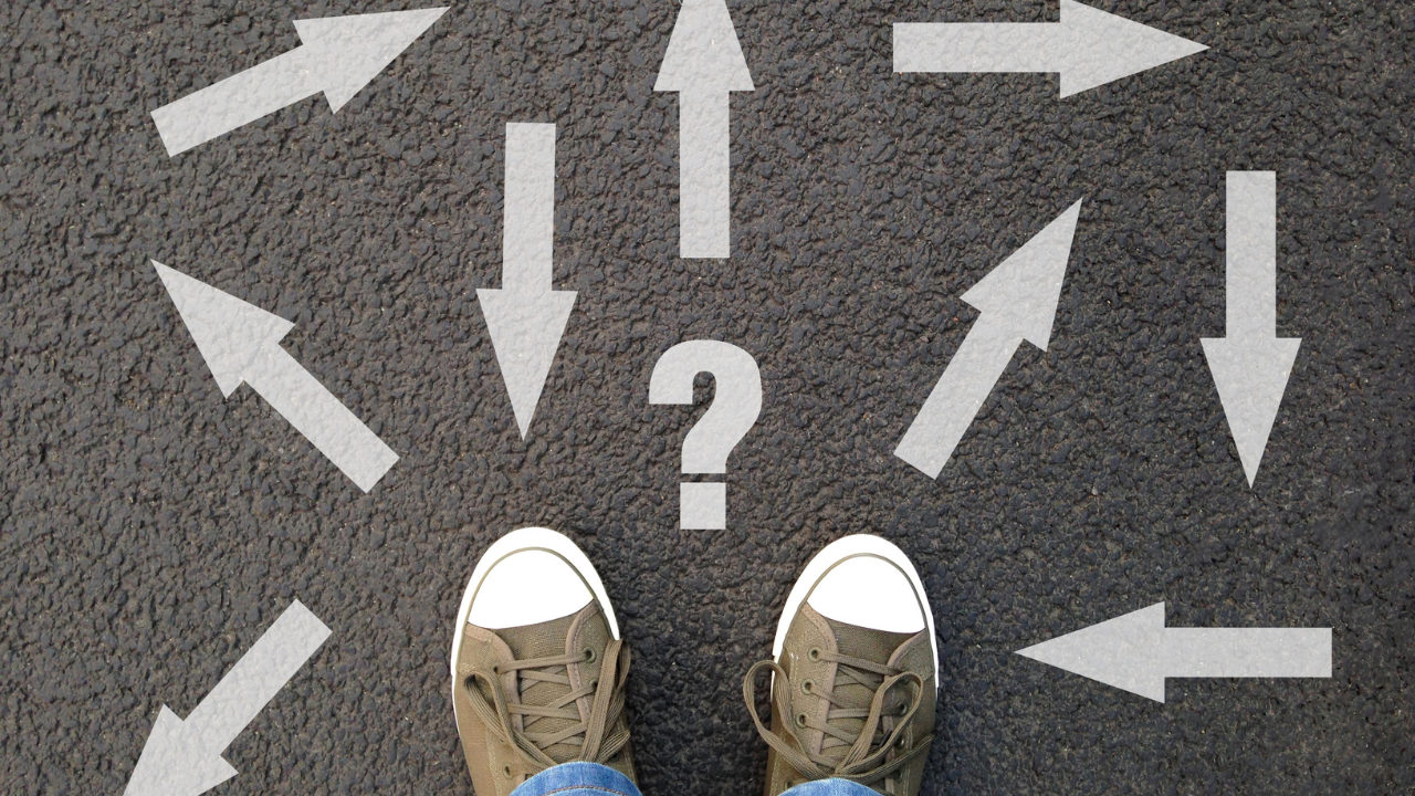A person considering their options and the direction they should take (arrows on the floor) | Scott Legal, P.C. A person considering their options and the direction they should take (arrows on the floor)
