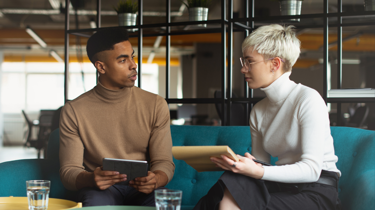 Two employers or employees having a discussion | Scott Legal, P.C. Two employers or employees having a discussion