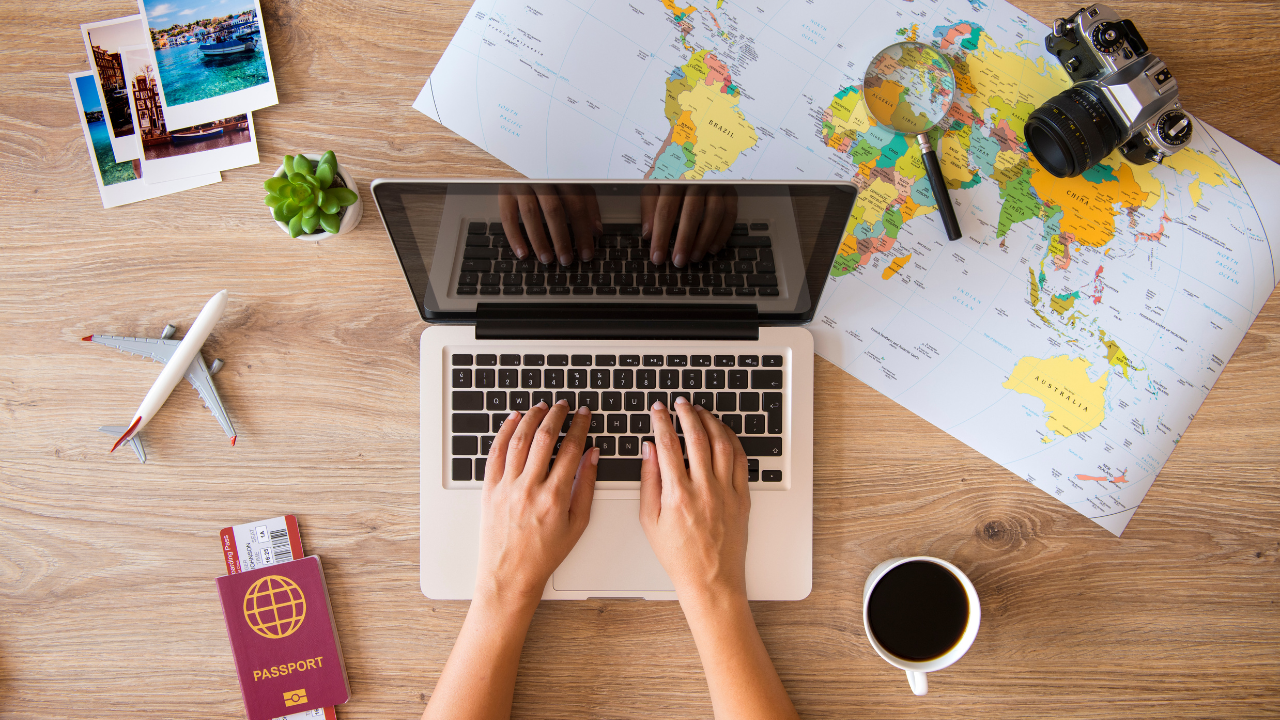 Someone working on a laptop while travelling | Scott Legal, P.C. Someone working on a laptop while travelling