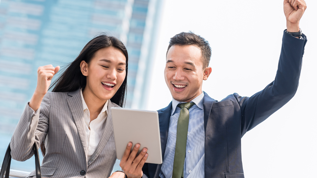Two professionals reading an article on an Ipad | Scott Legal, P.C. Two professionals reading an article on an Ipad