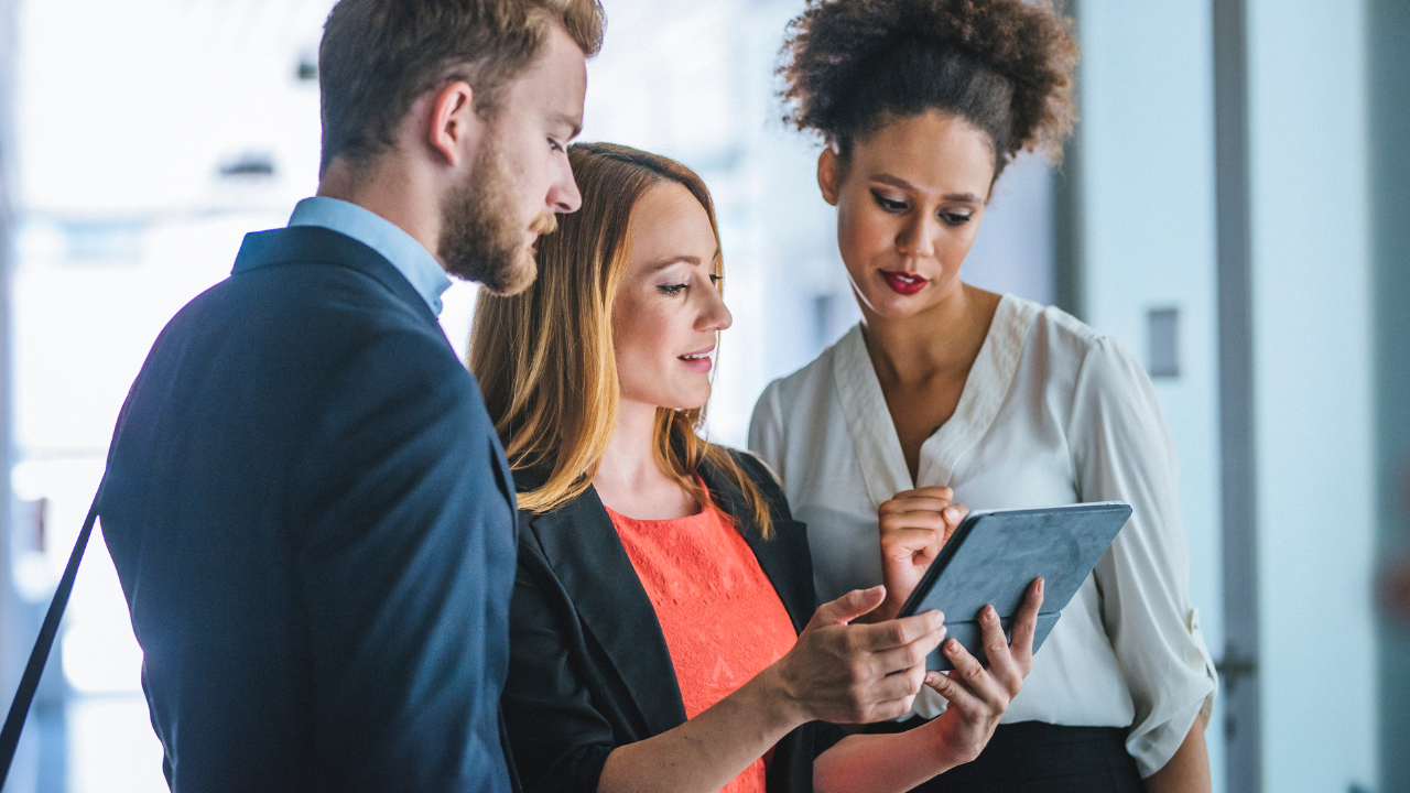 Two people going over their immigration options with an attorney | Scott Legal, P.C. Two people going over their immigration options with an attorney