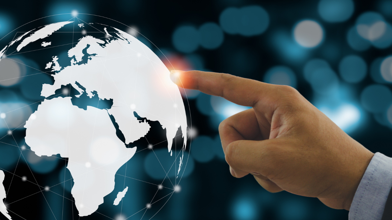 A finger pointing to a location on the globe | Scott Legal, P.C. A finger pointing to a location on the globe