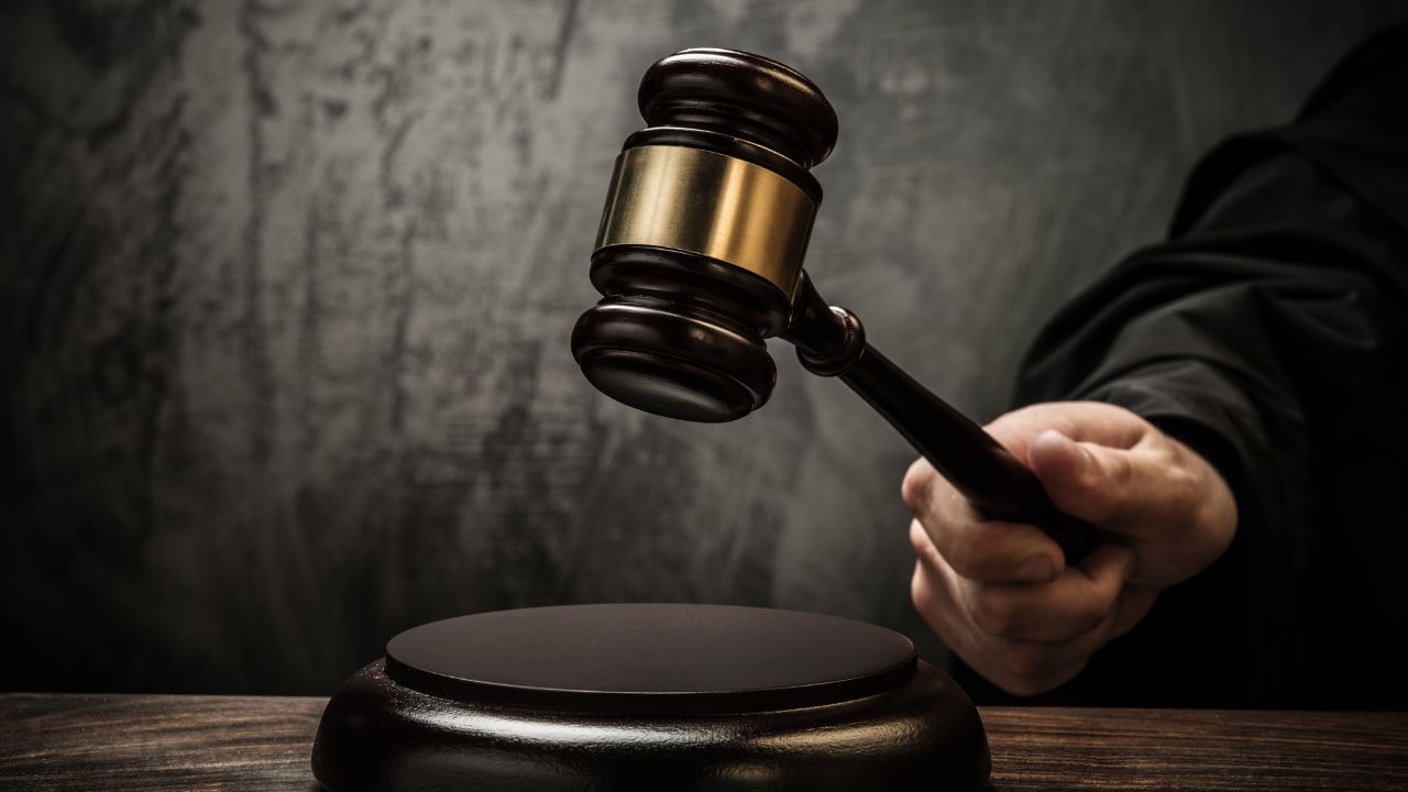 A judge with their gavel | Scott Legal, P.C. A judge with their gavel