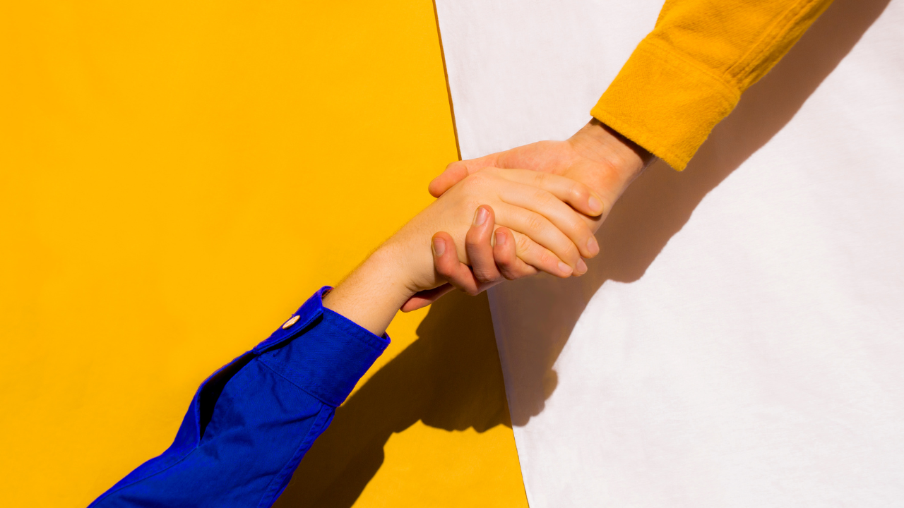 A helping hand being offered from one person to another | Scott Legal, P.C. A helping hand being offered from one person to another