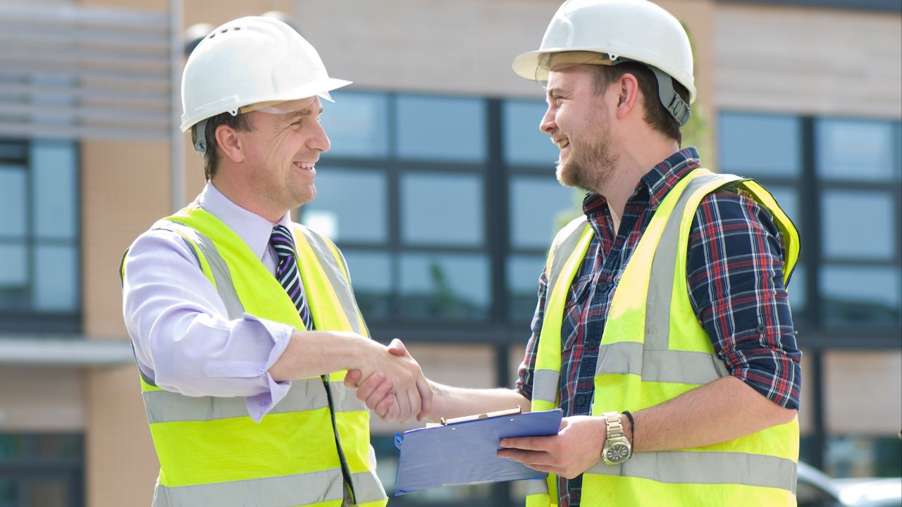 Two independent contractors shaking hands | Scott Legal, P.C. Two independent contractors shaking hands