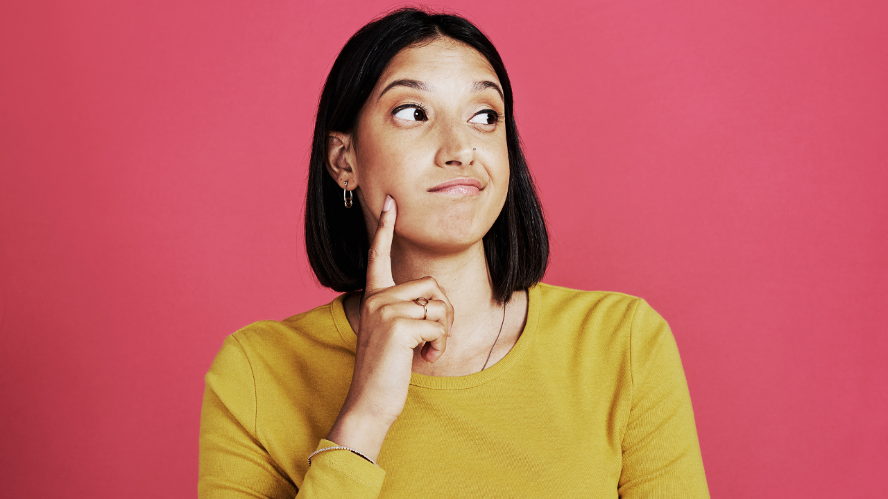 A woman thinking about potential answers to her questions | Scott Legal, P.C. A woman thinking about potential answers to her questions