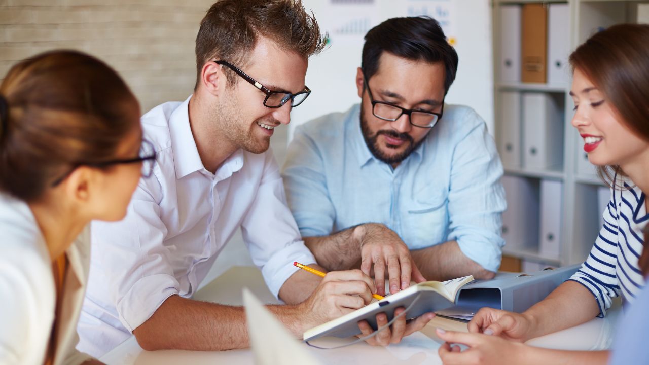A team working on a business plan | Scott Legal, P.C. A team working on a business plan