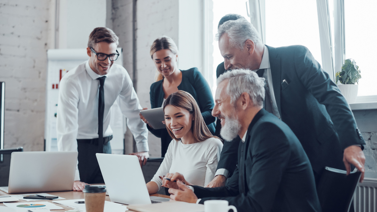 A group of professionals gathered in a meeting | Scott Legal, P.C. A group of professionals gathered in a meeting