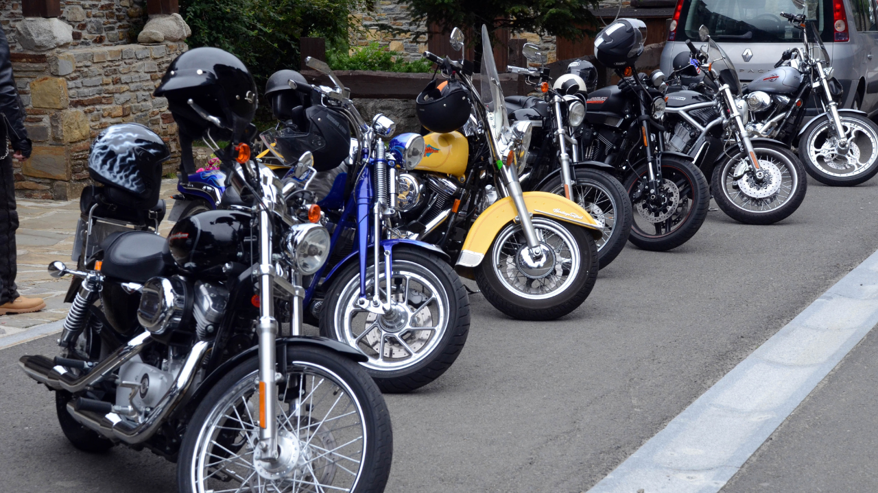 A collection of motorcycles parked at the side of the road | Scott Legal, P.C. A collection of motorcycles parked at the side of the road