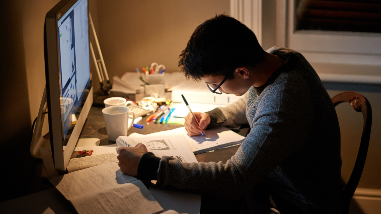 A man studying in front of a computer | Scott Legal, P.C. A man studying in front of a computer