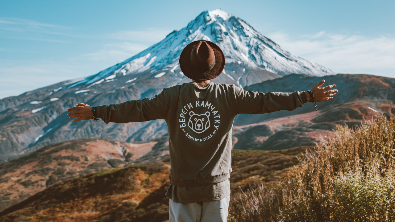 A man enjoying his travels in the mountains | Scott Legal, P.C. A man enjoying his travels in the mountains
