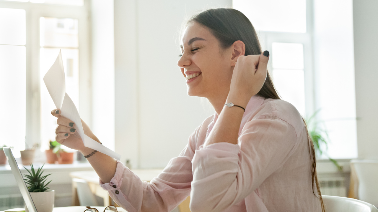 A woman reading a letter of support that she received | Scott Legal, P.C. A woman reading a letter of support that she received