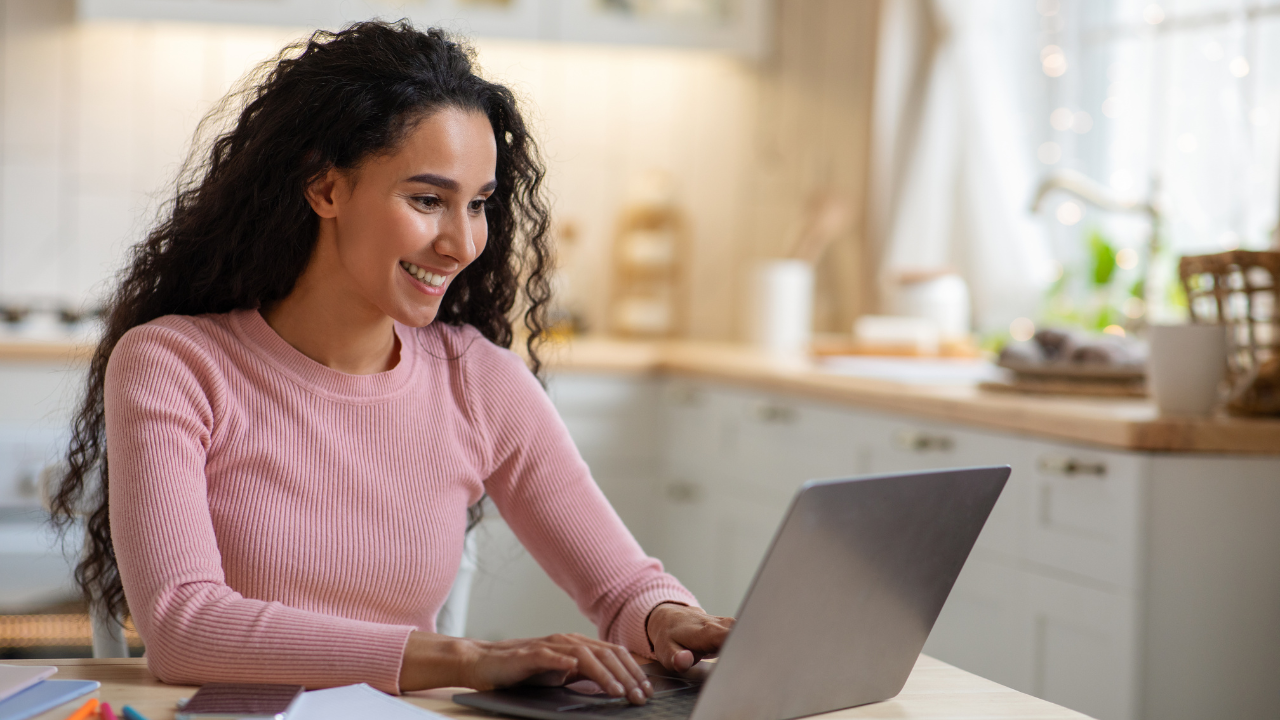A woman considering her E2 options on her laptop | Scott Legal, P.C. A woman considering her E2 options on her laptop