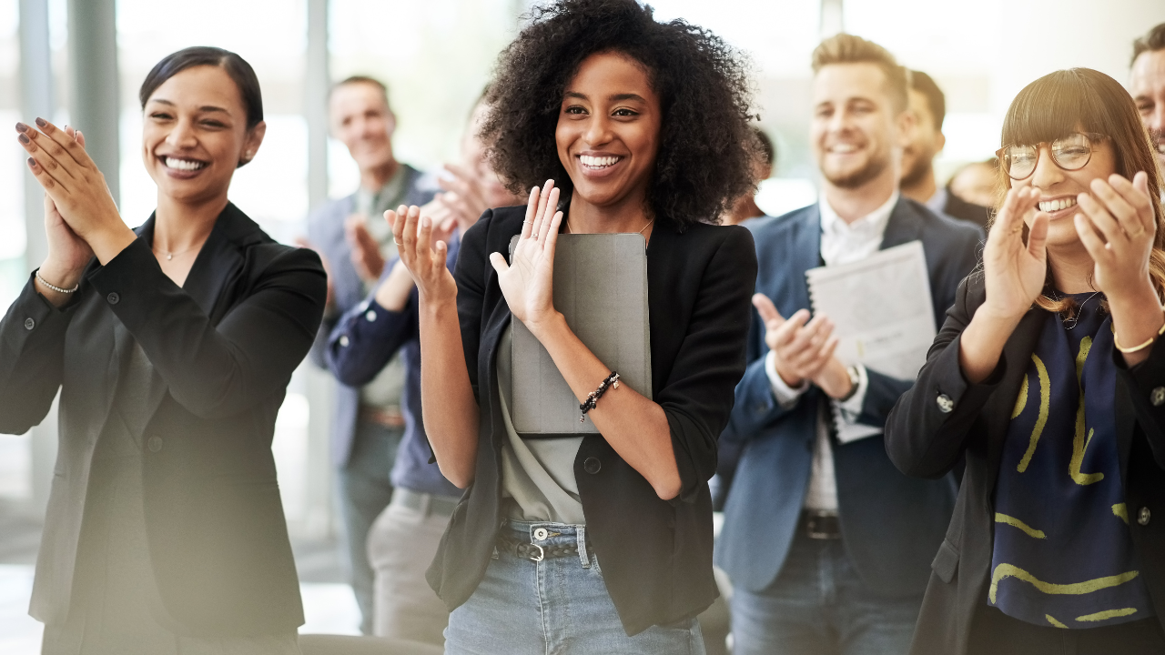 A team clapping after an approval | Scott Legal, P.C. A team clapping after an approval