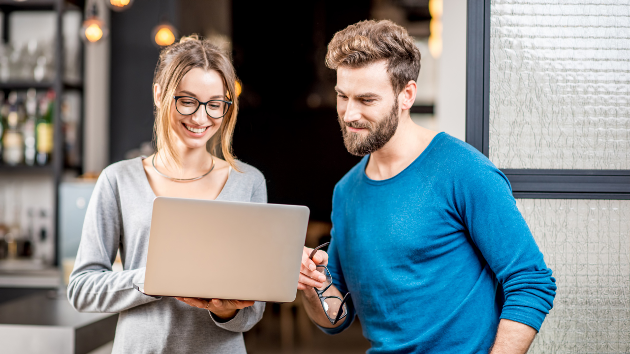 Two individuals looking at their options on a laptop | Scott Legal, P.C. Two individuals looking at their options on a laptop