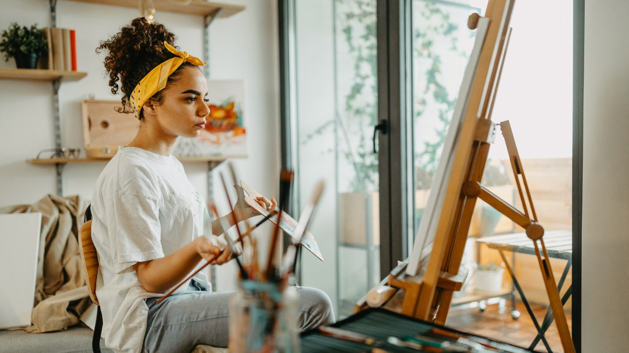 An artist working on their art | Scott Legal, P.C. An artist working on their art