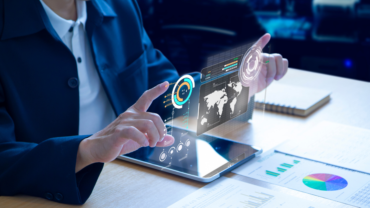 A professional looking at her investments on a tablet | Scott Legal, P.C. A professional looking at her investments on a tablet