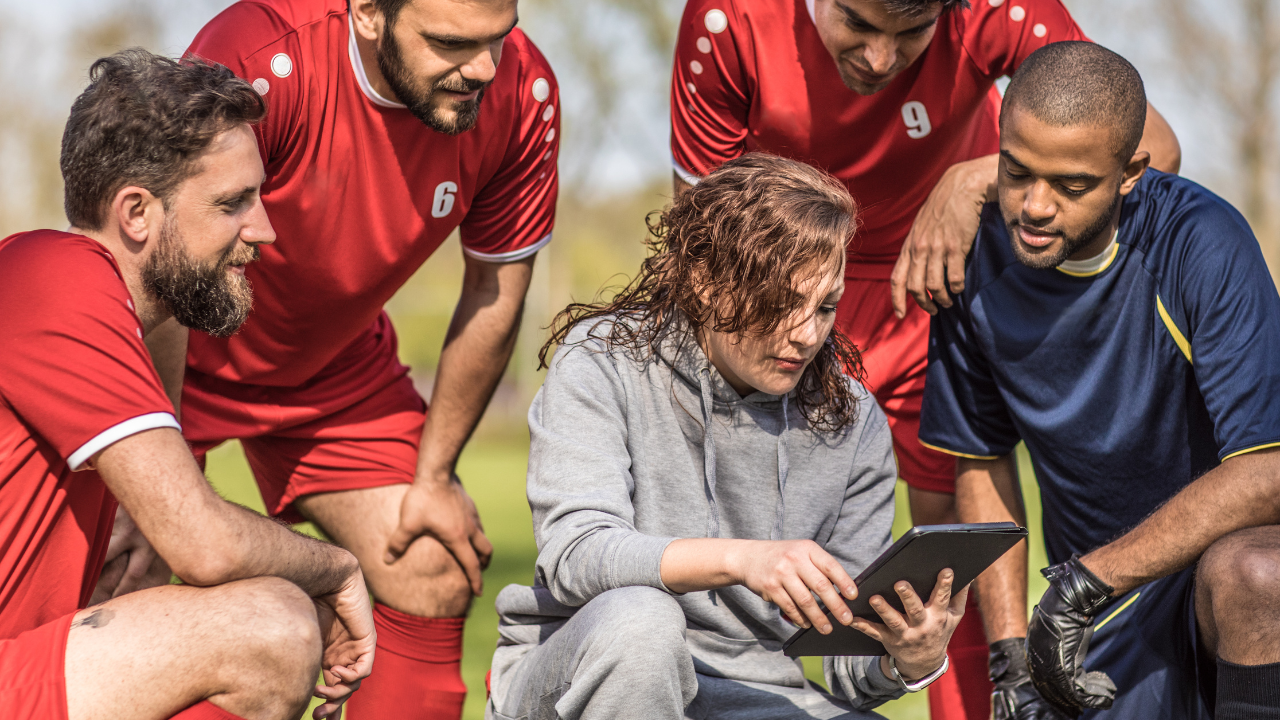 A soccer coach with their team | Scott Legal, P.C. A soccer coach with their team