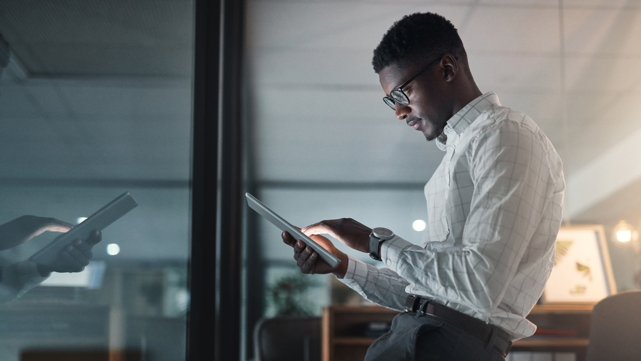 A business professional considering their business options on a tablet in front of them | Scott Legal, P.C. A business professional considering their business options on a tablet in front of them