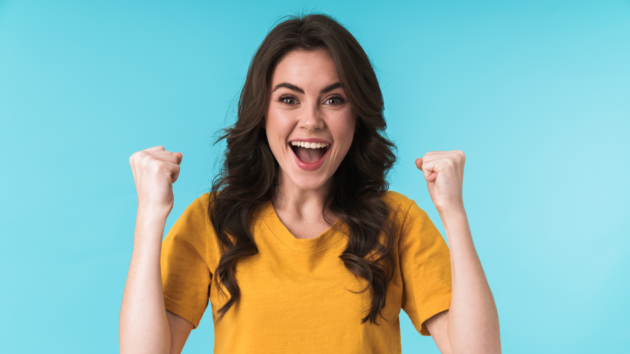 A woman celebrating being selected in the diversity visa lottery | Scott Legal, P.C. A woman celebrating being selected in the diversity visa lottery