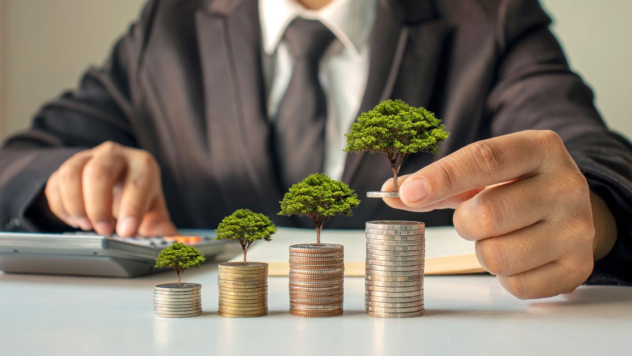 A man counting his investments and growth | Scott Legal, P.C. A man counting his investments and growth