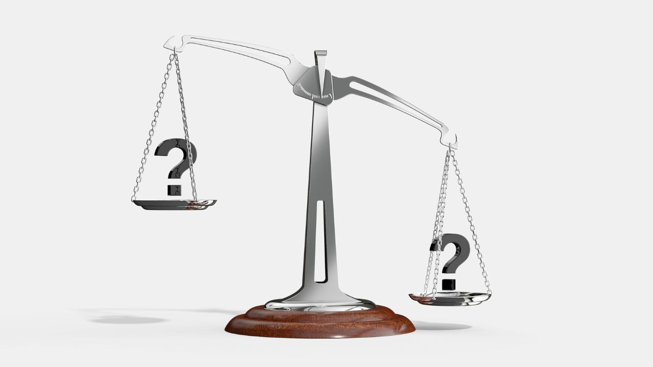 A scale weighing two options | Scott Legal, P.C. A scale weighing two options