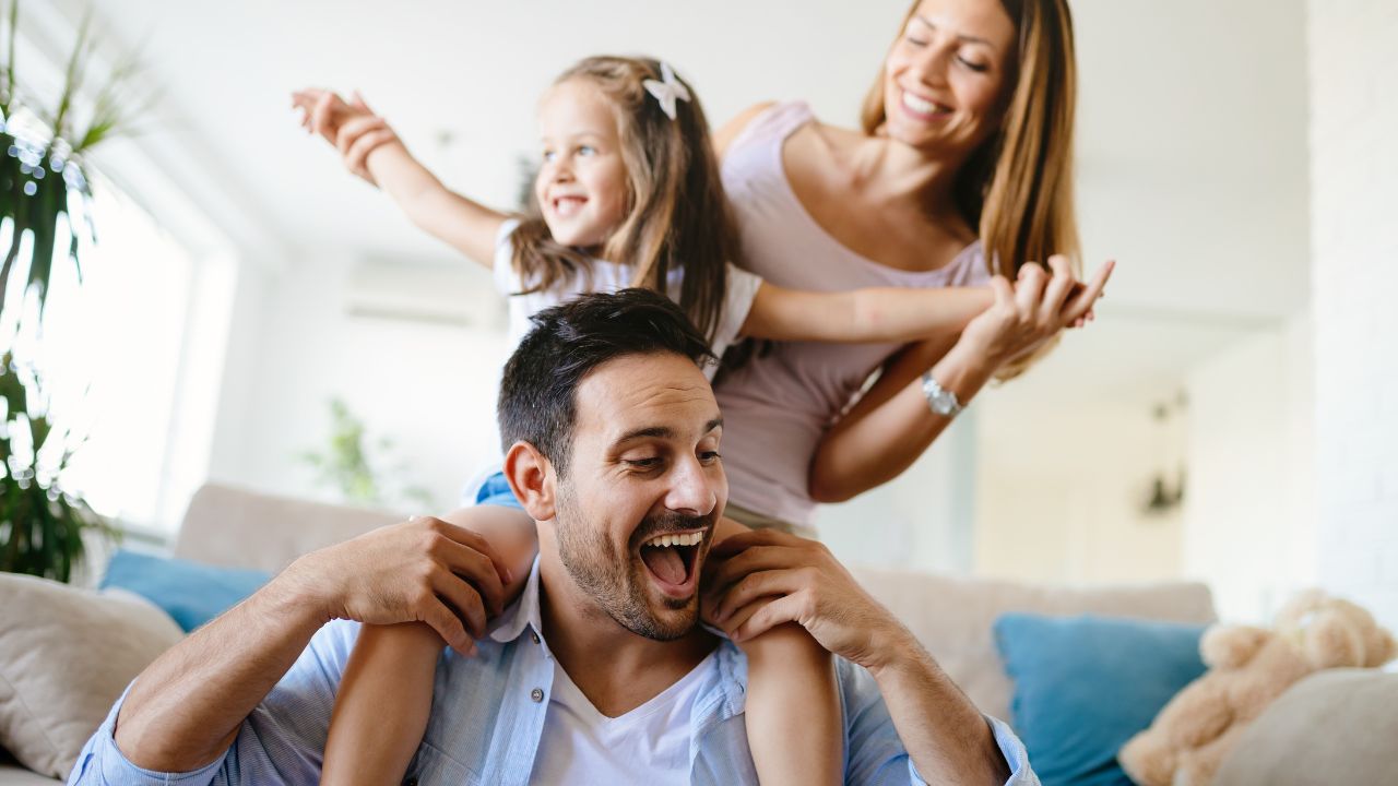 A happy family in their home. | Scott Legal, P.C. A happy family in their home.