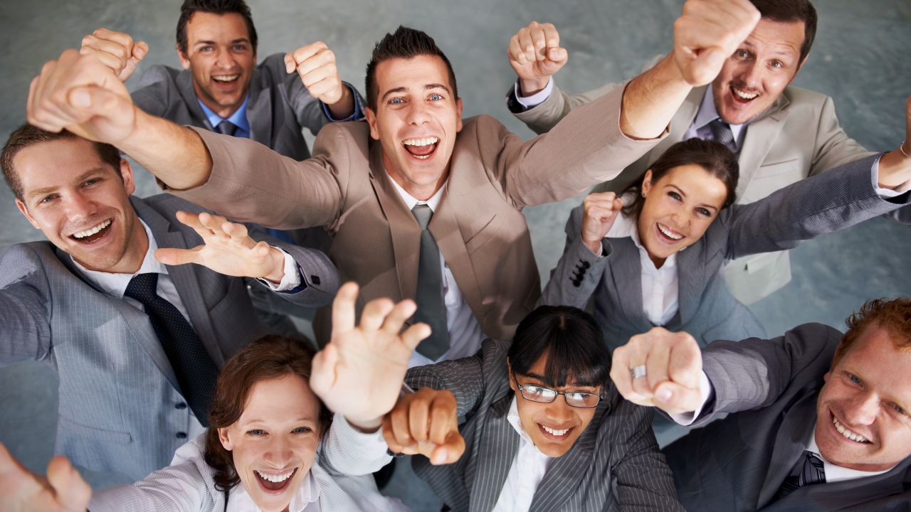 A team of professionals celebrating a win | Scott Legal, P.C. A team of professionals celebrating a win