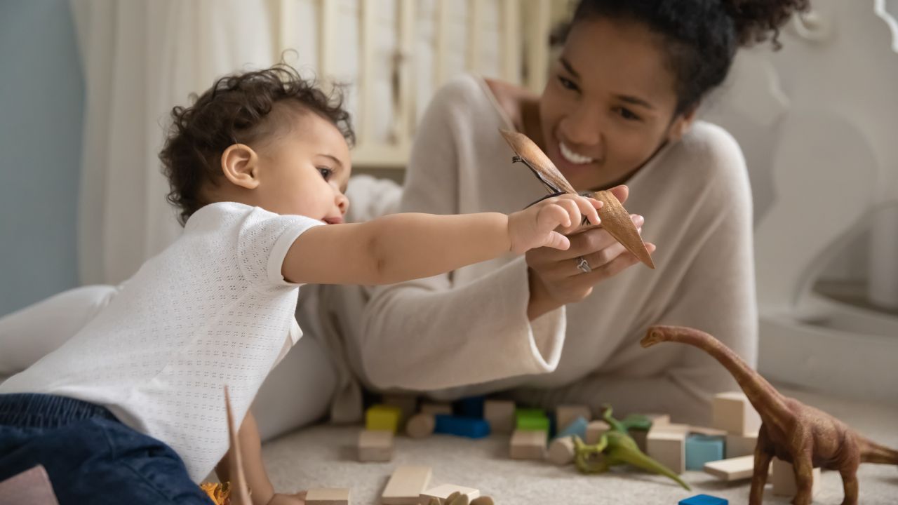 A nanny playing with a child | Scott Legal, P.C. A nanny playing with a child