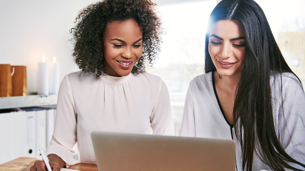 Two employees working at their new employment | Scott Legal, P.C. Two employees working at their new employment