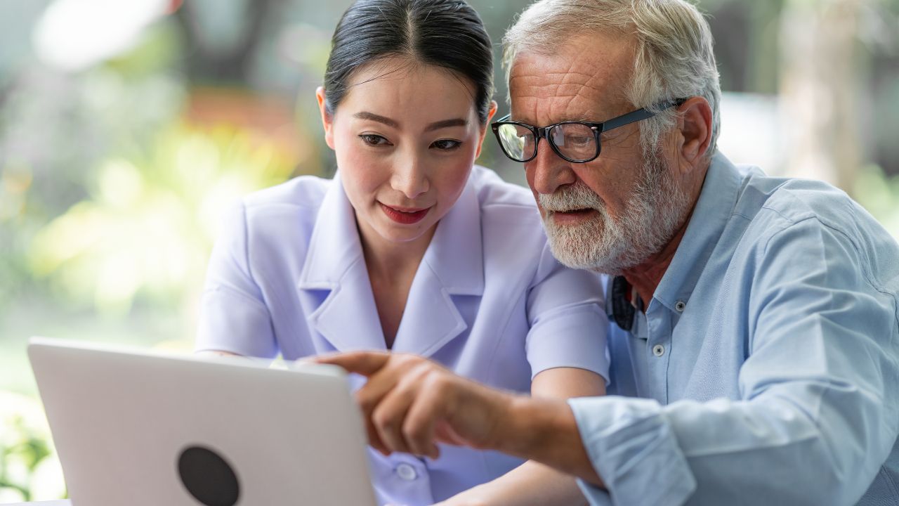 Two individuals figuring out their options on their laptop | Scott Legal, P.C. Two individuals figuring out their options on their laptop