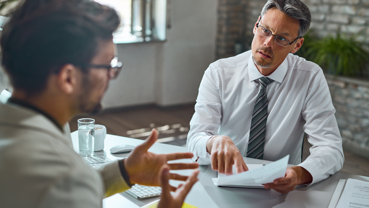 experienced workers speaking to each other | Scott Legal, P.C. experienced workers speaking to each other
