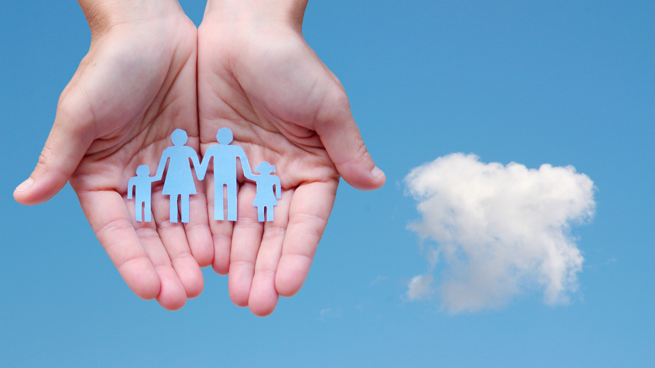 A hand holding a family | Scott Legal, P.C. A hand holding a family
