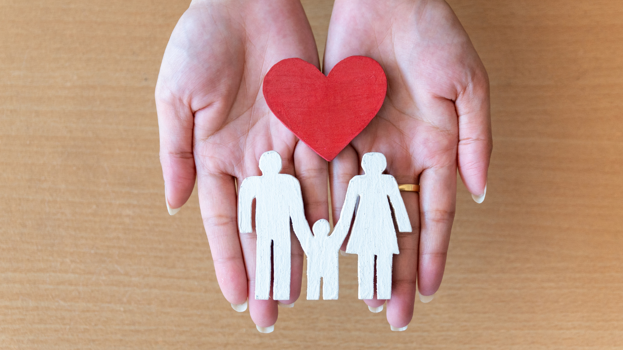 cut out of a family resting in a hand | Scott Legal, P.C. cut out of a family resting in a hand