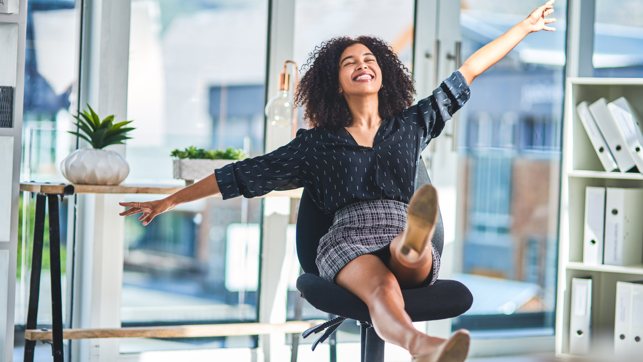 A woman celebrating being successful and succeeding | Scott Legal, P.C. A woman celebrating being successful and succeeding.