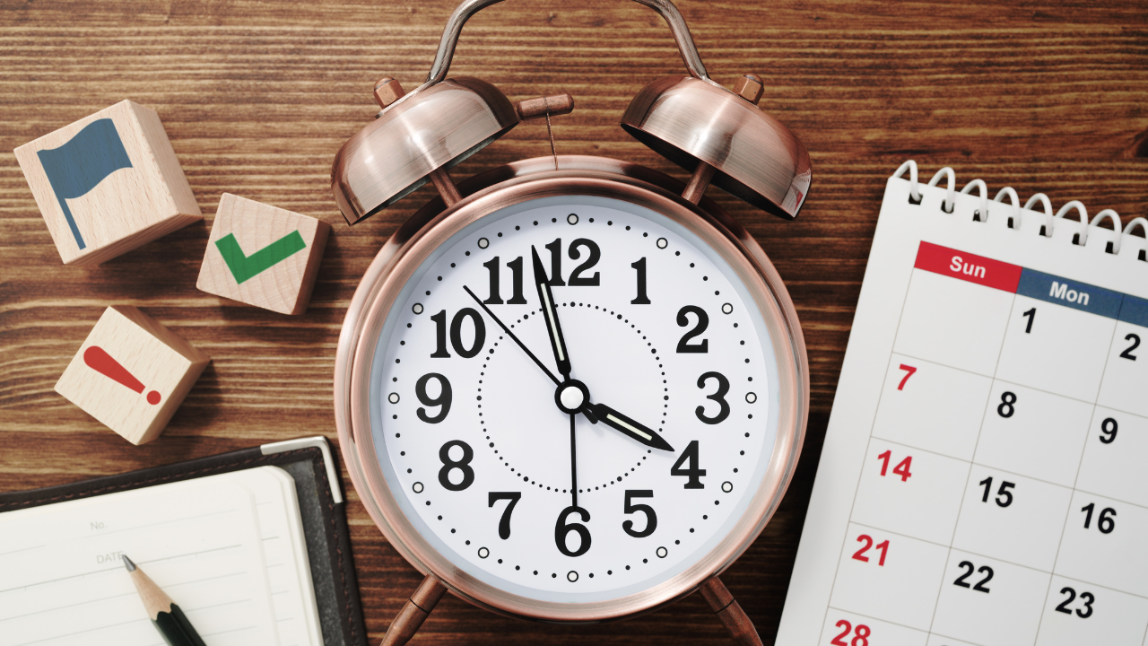 A clock and calendar on a table | Scott Legal, P.C. A clock and calendar on a table